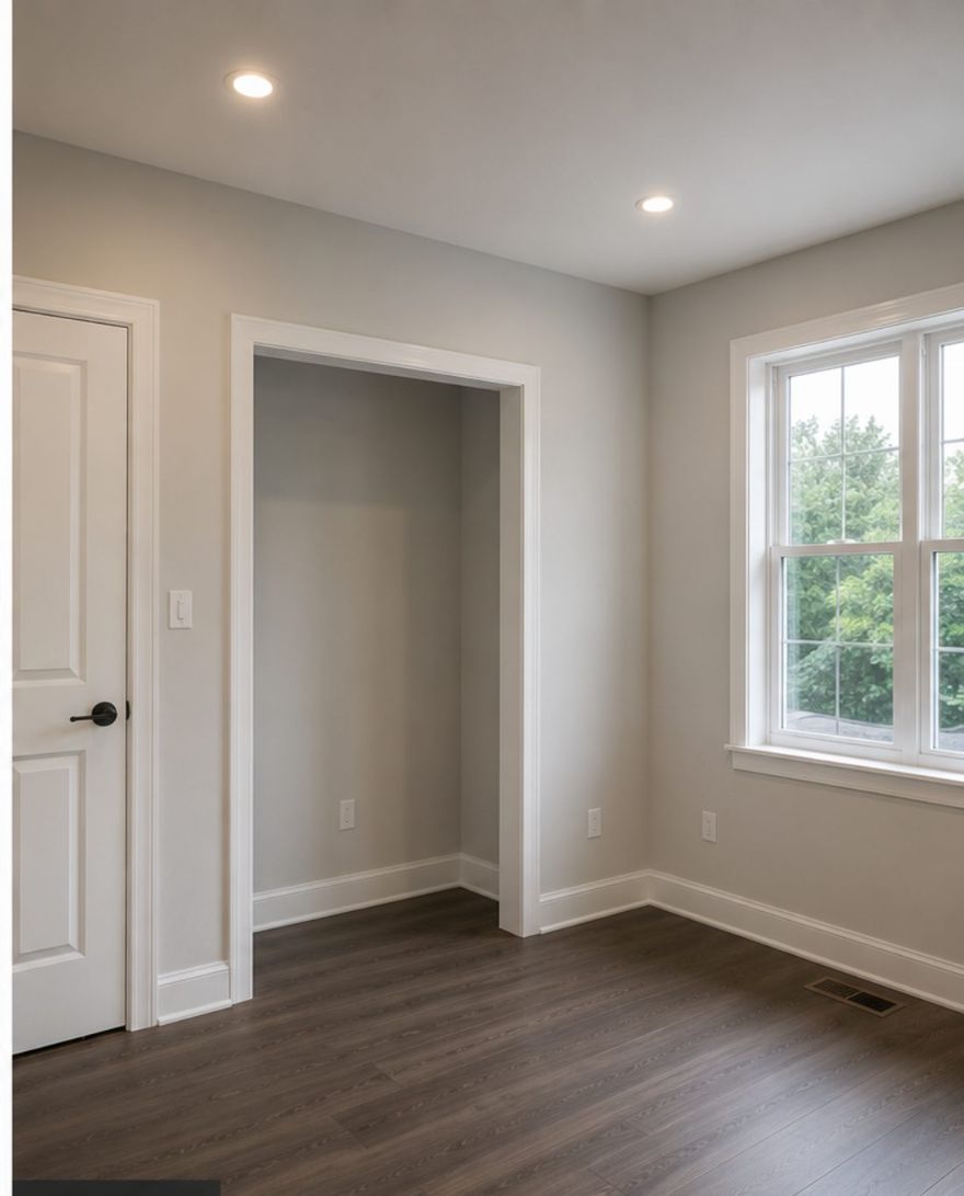 Bedroom with new drywall, primed and painted in soft grey